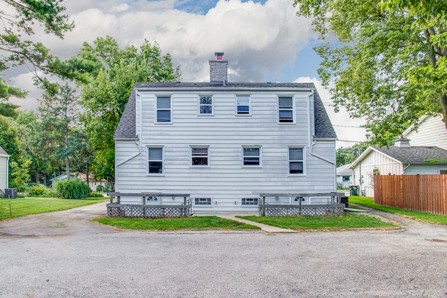 263-265 Chicago Road Oswego, IL 60543 - Photo 23 of 25 a view of front a house with a yard