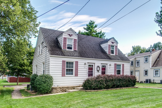 263-265 Chicago Road Oswego, IL 60543 - Photo 24 of 25 a front view of house with yard and green space