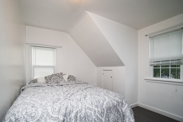 263-265 Chicago Road Oswego, IL 60543 - Photo 7 of 25 a bedroom with a bed and a window