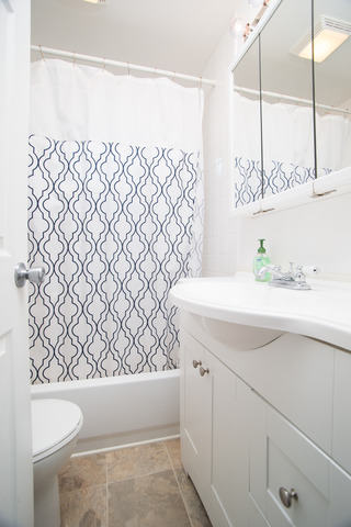263-265 Chicago Road Oswego, IL 60543 - Photo 8 of 25 a bathroom with a sink and a mirror