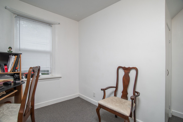 263-265 Chicago Road Oswego, IL 60543 - Photo 9 of 25 a view of a workspace with furniture and a window