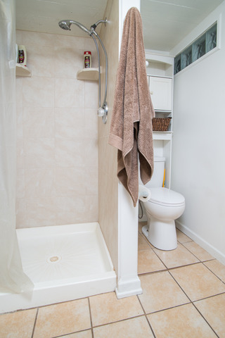 263-265 Chicago Road Oswego, IL 60543 - Photo 10 of 25 a bathroom with a shower and a toilet