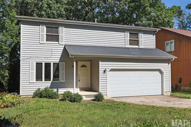 a view of front of house with a yard