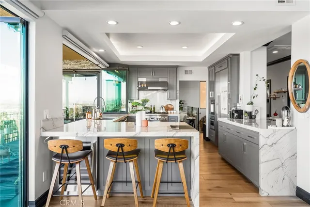 a kitchen with granite countertop a sink and a large window