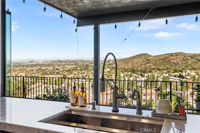 a view of a balcony with lake view and mountain view