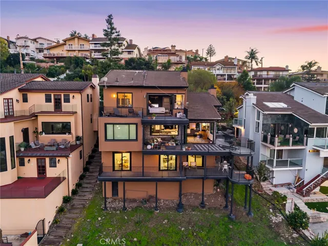 a view of a house with more windows and brick walls