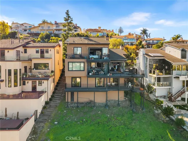 a front view of a residential apartment building with a yard