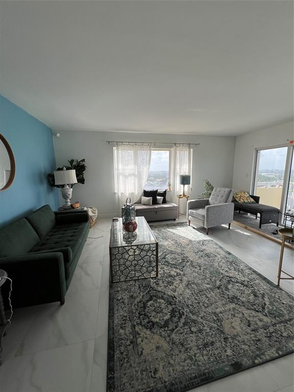 1200 Hibiscus Avenue, Unit 1501 Pompano Beach, FL 33062 - Photo 19 of 40 a living room with furniture