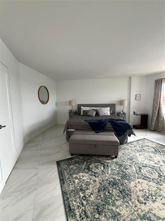 1200 Hibiscus Avenue, Unit 1501 Pompano Beach, FL 33062 - Photo 22 of 40 a living room with furniture and a rug