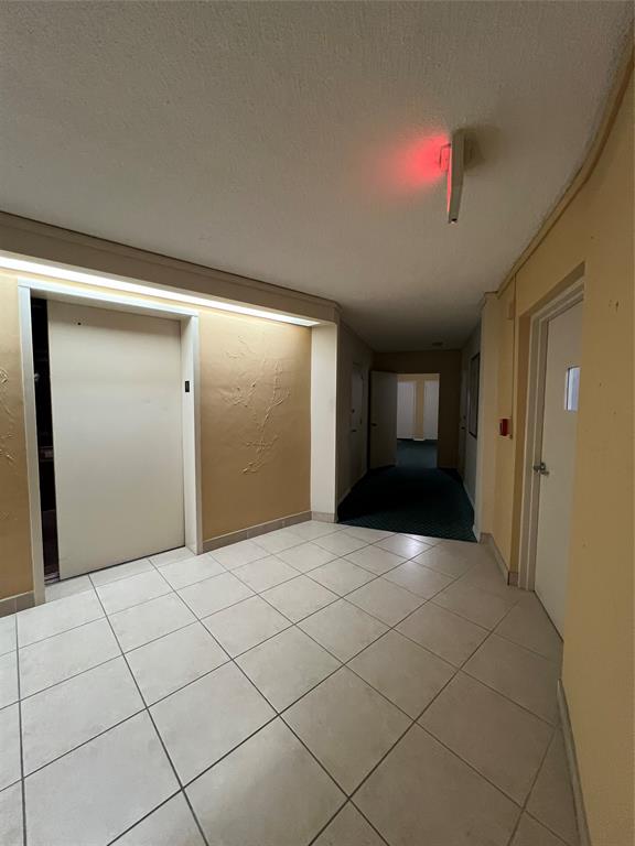 1200 Hibiscus Avenue, Unit 1501 Pompano Beach, FL 33062 - Photo 23 of 40 a view of an empty room and window