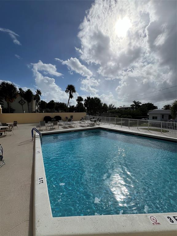 1200 Hibiscus Avenue, Unit 1501 Pompano Beach, FL 33062 - Photo 24 of 40 a view of a lake with houses