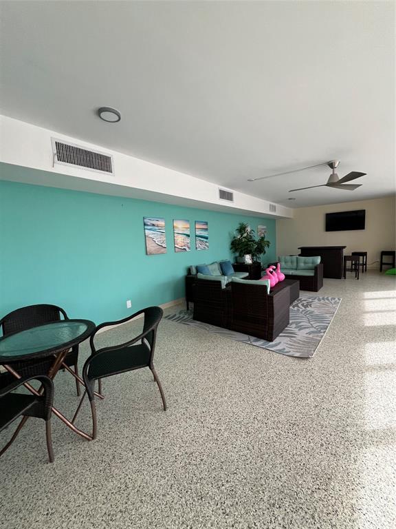 1200 Hibiscus Avenue, Unit 1501 Pompano Beach, FL 33062 - Photo 27 of 40 a living room with furniture and a flat screen tv