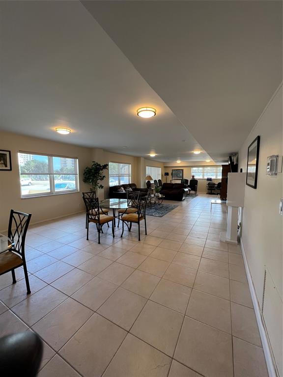 1200 Hibiscus Avenue, Unit 1501 Pompano Beach, FL 33062 - Photo 29 of 40 a lobby with furniture and floor to ceiling window