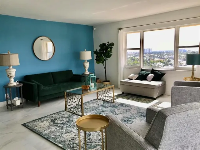 a living room with furniture rug and window