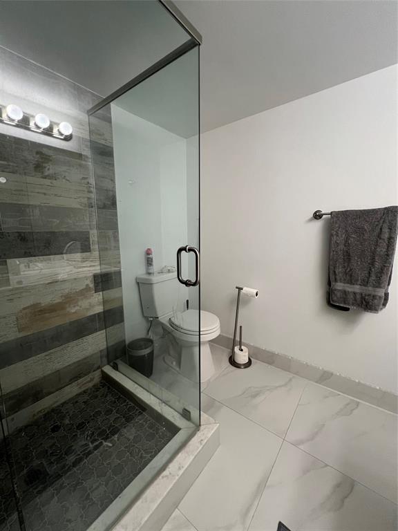 1200 Hibiscus Avenue, Unit 1501 Pompano Beach, FL 33062 - Photo 5 of 40 a bathroom with a shower