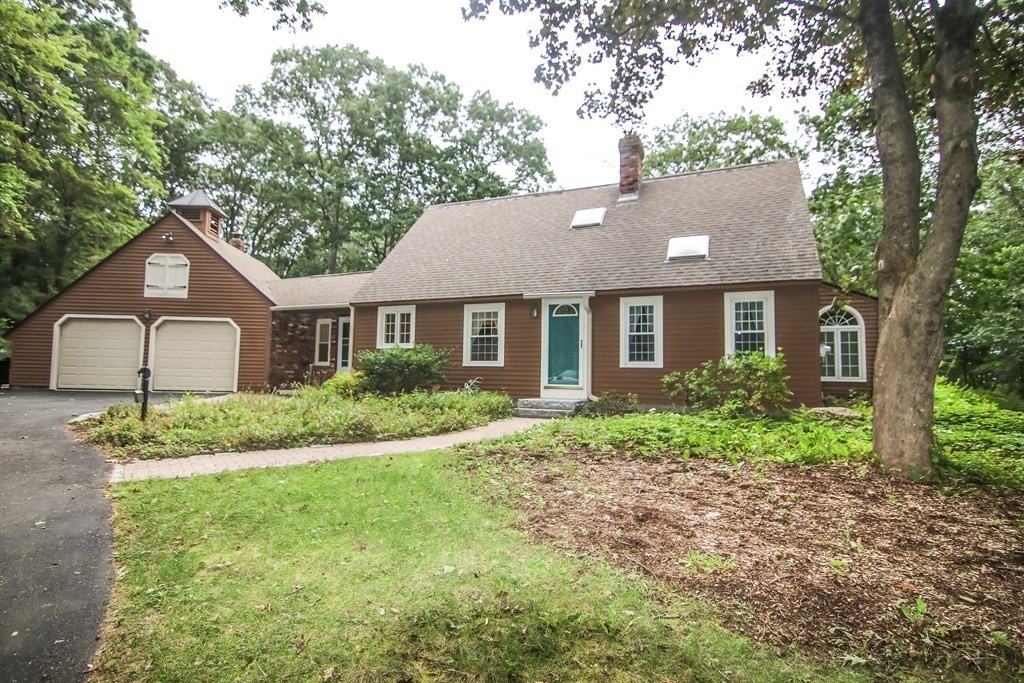 69 John Gilbert Road West Brookfield, MA 01585 - Photo 1 of 41 a view of a yard in front of a house with large windows