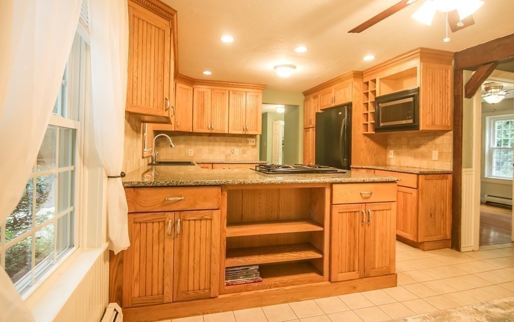 69 John Gilbert Road West Brookfield, MA 01585 - Photo 12 of 41 a kitchen with stainless steel appliances granite countertop a refrigerator and cabinets
