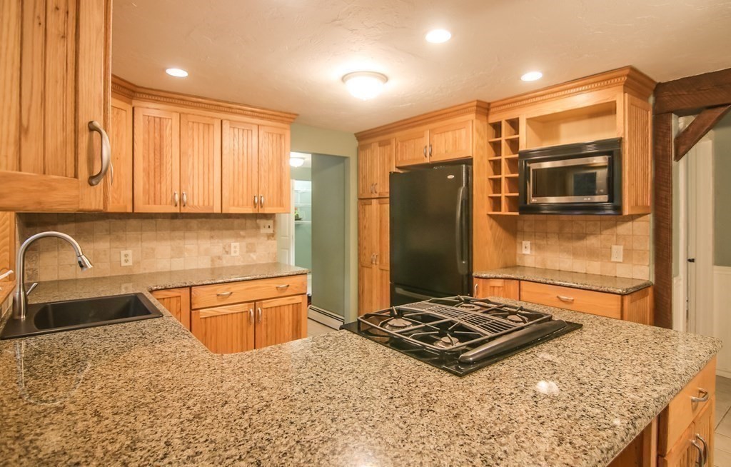 69 John Gilbert Road West Brookfield, MA 01585 - Photo 13 of 41 a kitchen with stainless steel appliances granite countertop a refrigerator and a sink