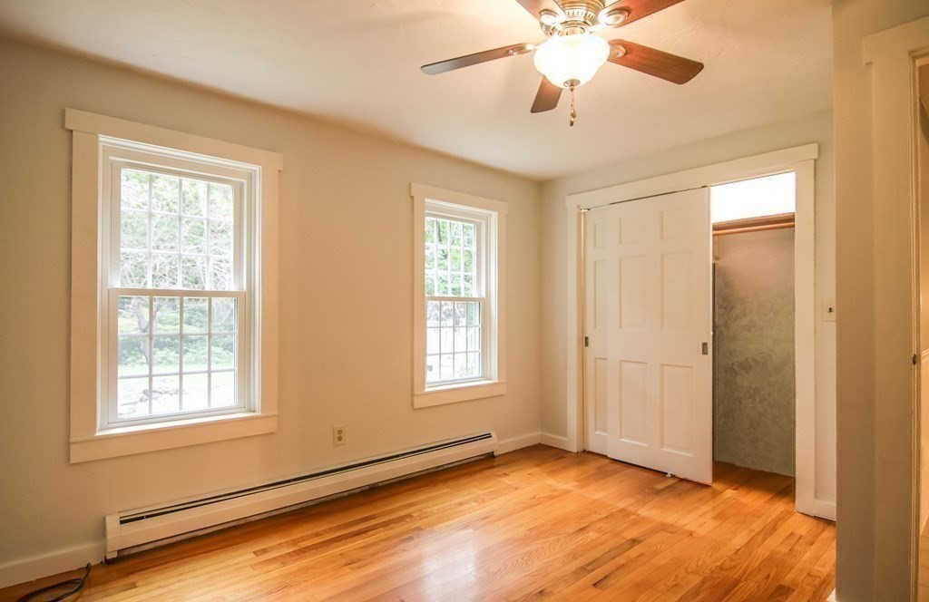 69 John Gilbert Road West Brookfield, MA 01585 - Photo 14 of 41 a view of an empty room with window and chandelier fan