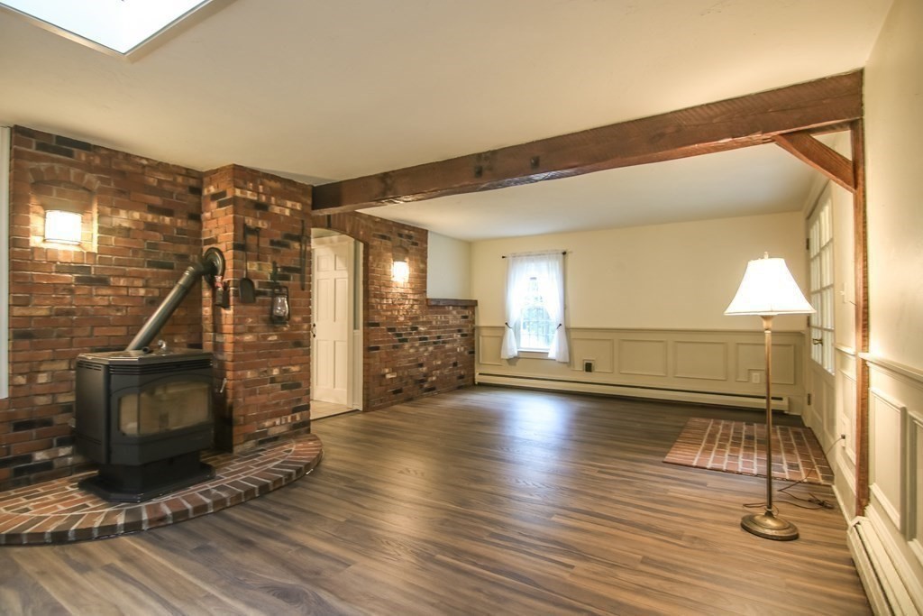 69 John Gilbert Road West Brookfield, MA 01585 - Photo 17 of 41 a view of a livingroom with wooden floor and a fireplace