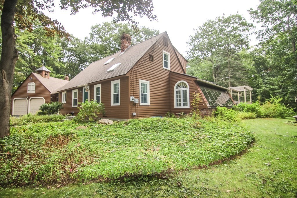 69 John Gilbert Road West Brookfield, MA 01585 - Photo 2 of 41 a view of a house with yard and a garden