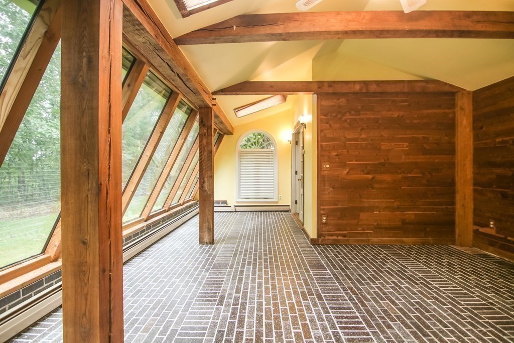 69 John Gilbert Road West Brookfield, MA 01585 - Photo 22 of 41 a view of a glass door with wooden floor and a yard