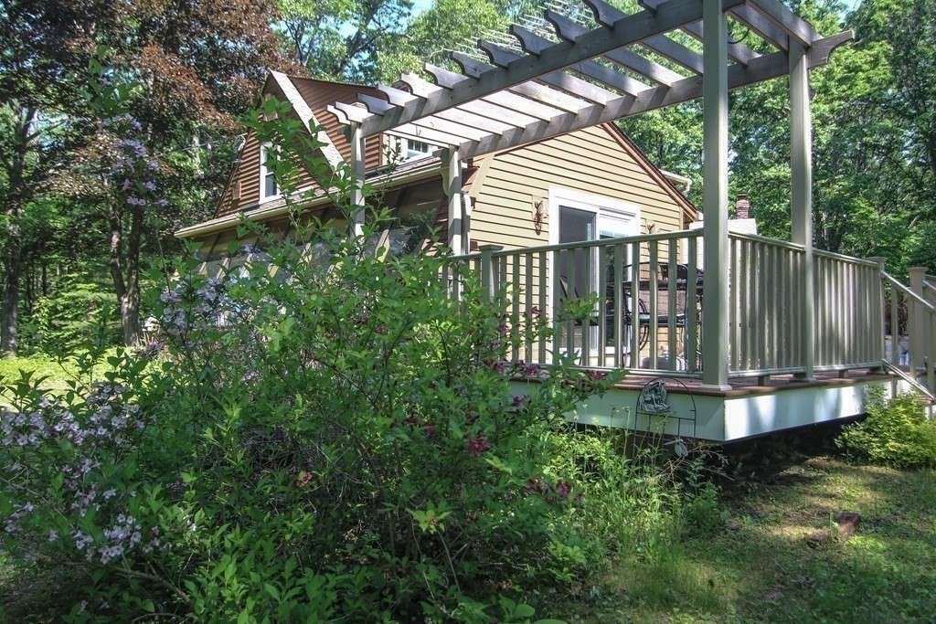 69 John Gilbert Road West Brookfield, MA 01585 - Photo 25 of 41 a view of a small yard with plants and large tree
