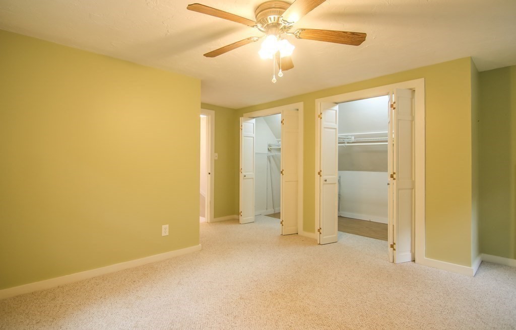 69 John Gilbert Road West Brookfield, MA 01585 - Photo 36 of 41 an empty room with a ceiling fan and a window