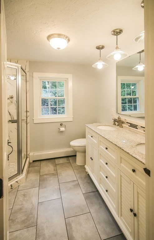 69 John Gilbert Road West Brookfield, MA 01585 - Photo 39 of 41 a bathroom with a double vanity sink toilet and shower