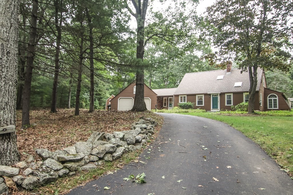 69 John Gilbert Road West Brookfield, MA 01585 - Photo 4 of 41 a front view of a house with a garden
