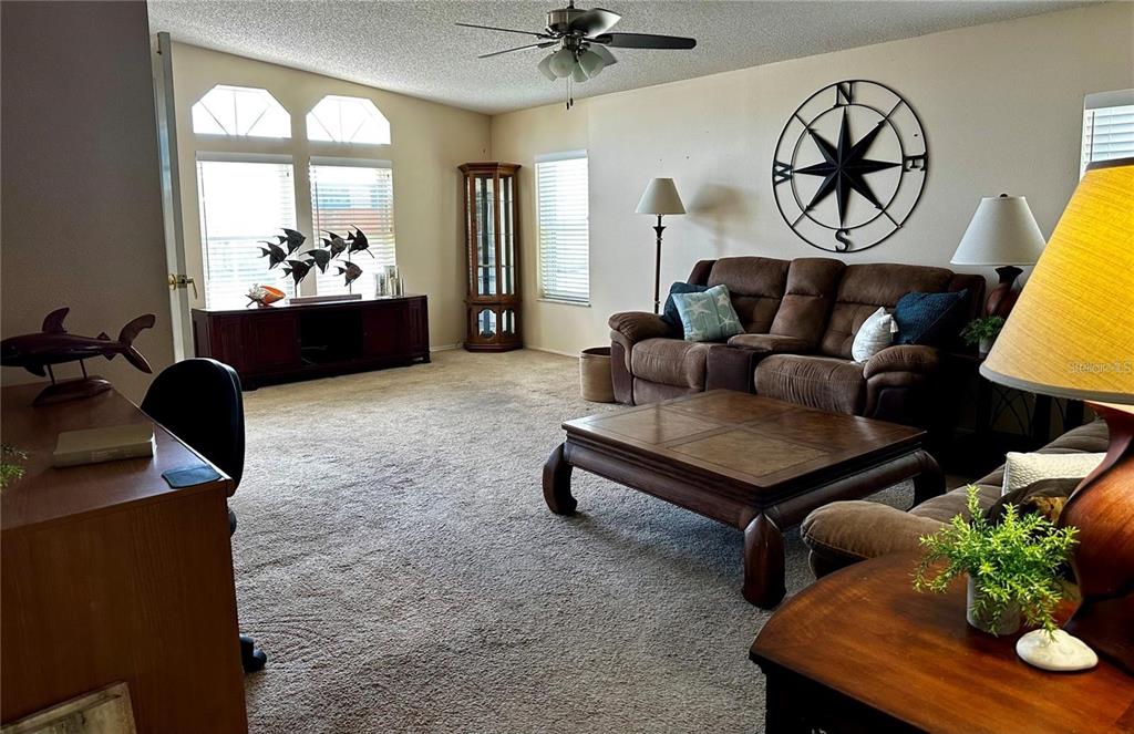 1100 South Belcher Road, Unit 406 Largo, FL 33771 - Photo 3 of 46 a living room with furniture and wooden floor