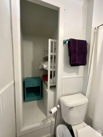 495 North Main Street Beaver, UT 84713 - Photo 11 of 18 Bathroom featuring a shower with shower curtain and wainscoting