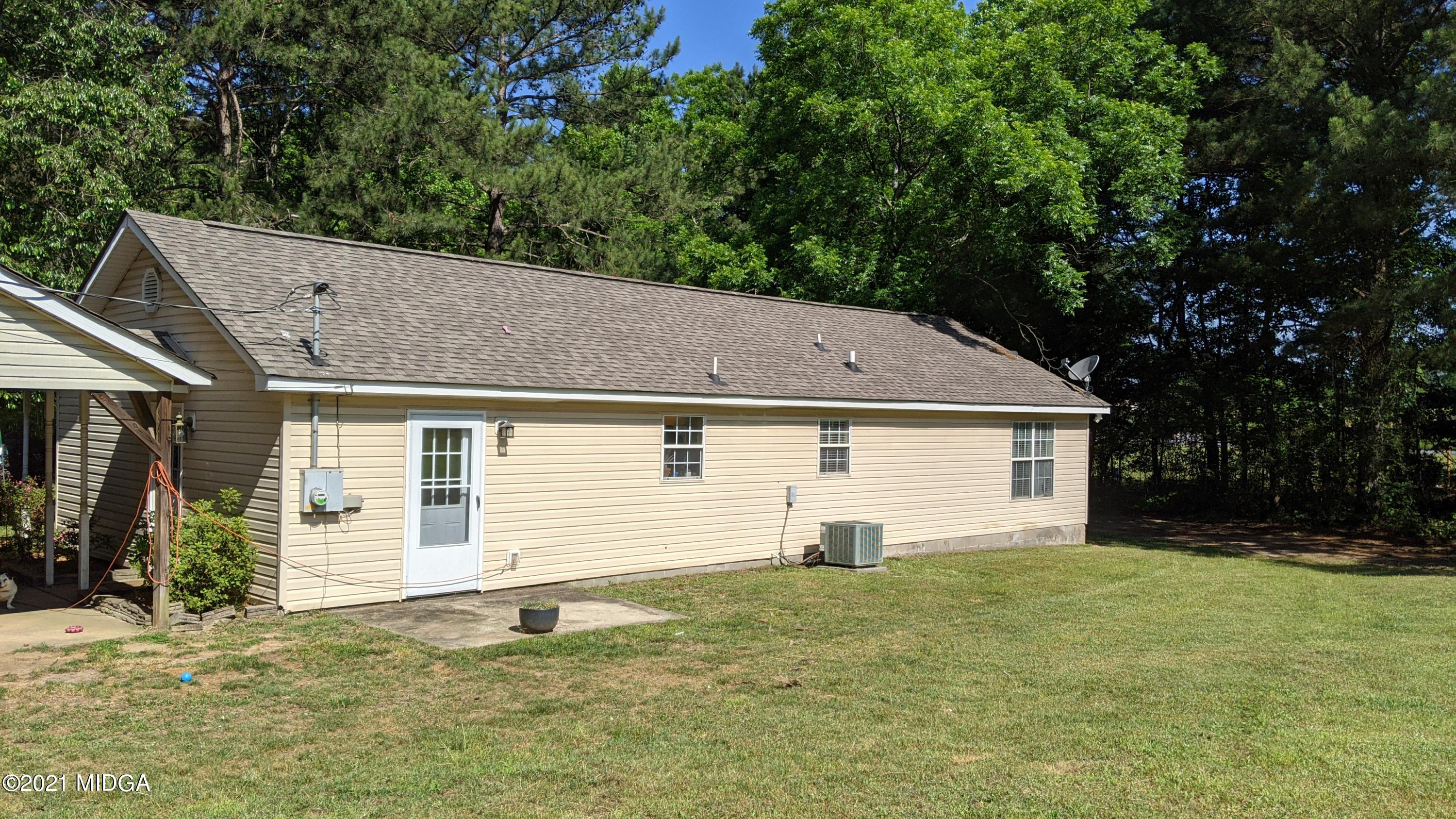 140 Rock Springs Road Milner, GA 30257 - Photo 14 of 15 a house with trees in the background