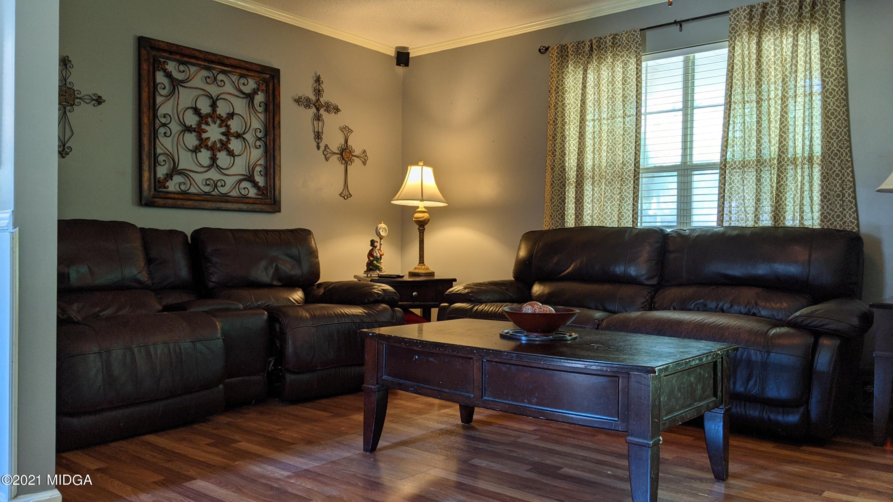 140 Rock Springs Road Milner, GA 30257 - Photo 4 of 15 a living room with furniture and a window