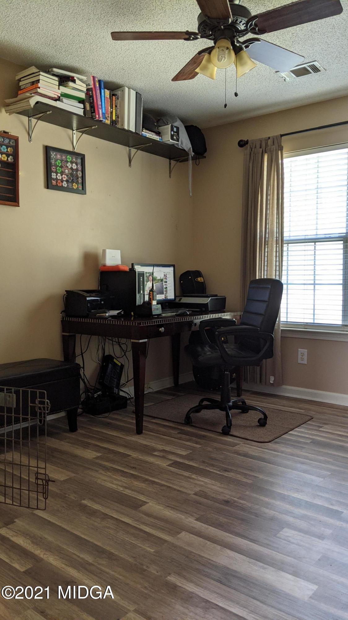 140 Rock Springs Road Milner, GA 30257 - Photo 10 of 15 a view of a workspace with furniture