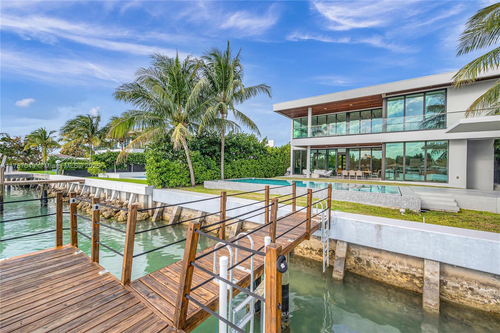 1234 South Biscayne Point Road Miami Beach, FL 33141 - Photo 2 of 30 a view of a swimming pool with a patio