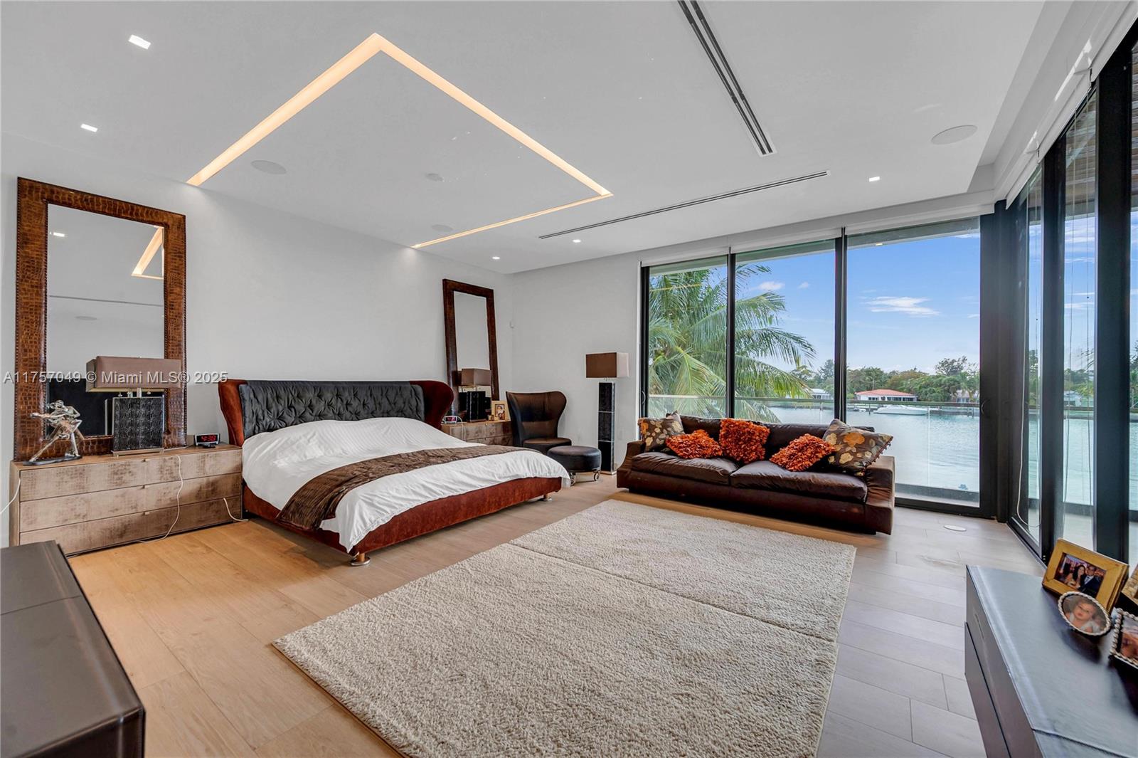 1234 South Biscayne Point Road Miami Beach, FL 33141 - Photo 24 of 30 a bedroom with a bed and large windows