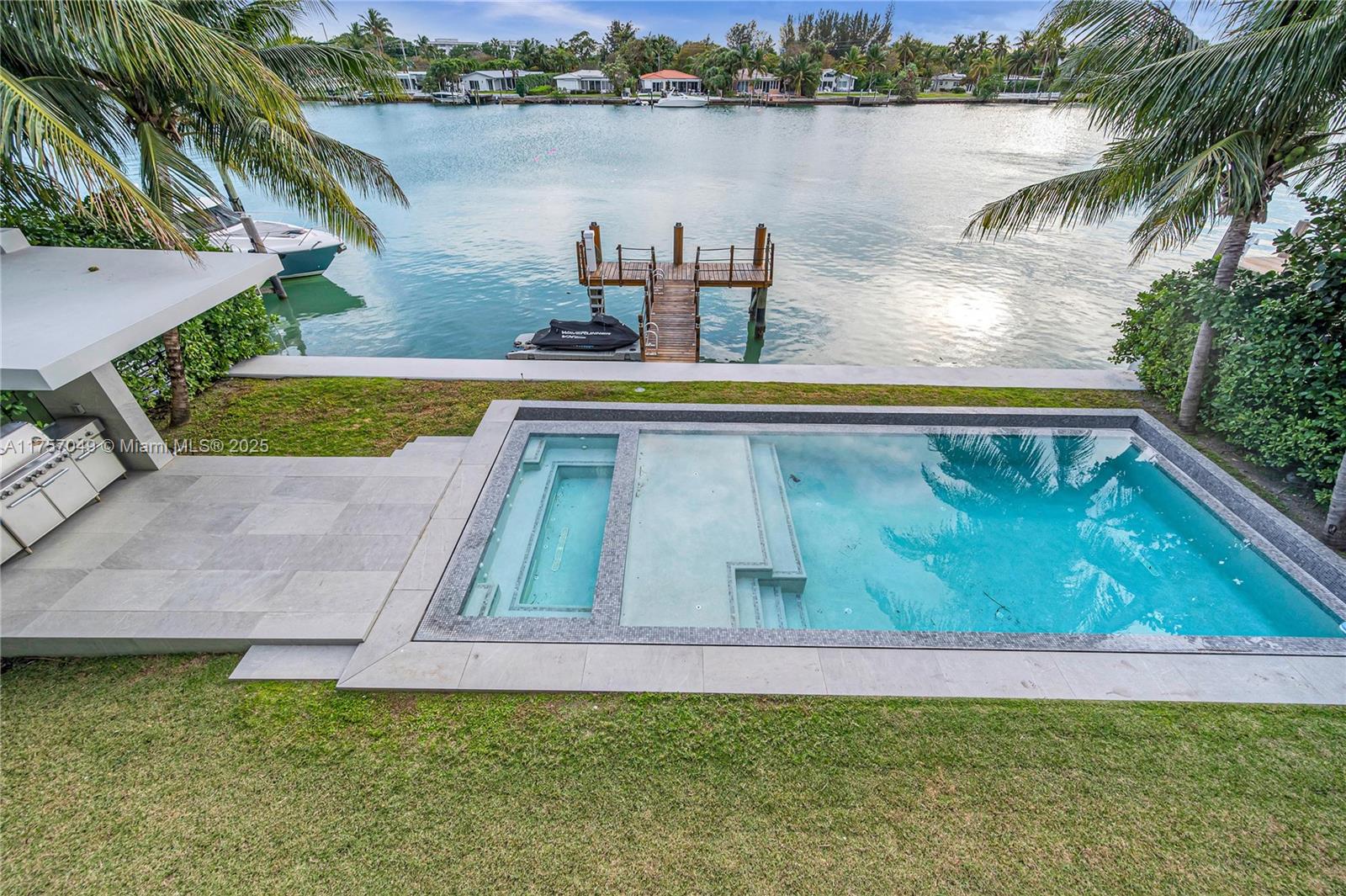 1234 South Biscayne Point Road Miami Beach, FL 33141 - Photo 4 of 30 a view of swimming pool with a yard and lake view