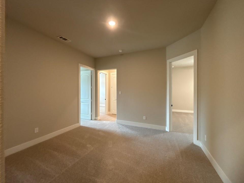 912 Creekview Whites Road Van Alstyne, TX 75495 - Photo 10 of 13 Plush carpet flooring with neutral paint tones, recessed lighting, and white trim