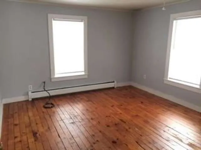 a stove top oven sitting inside of a kitchen