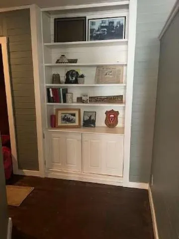 a view of a livingroom with furniture and window