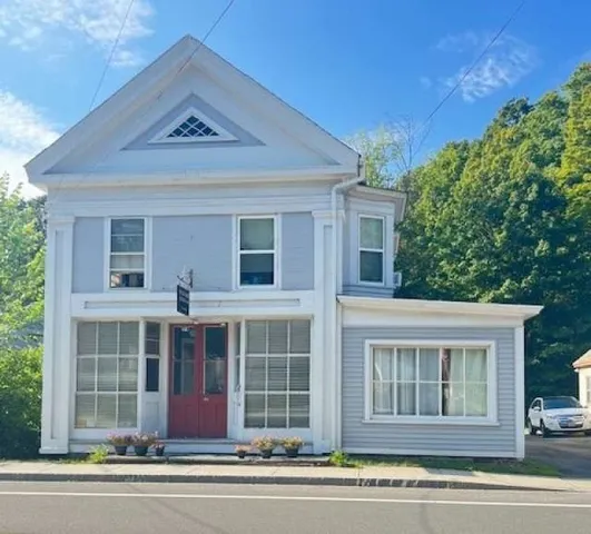 a view of a house with a window and a ceiling tree