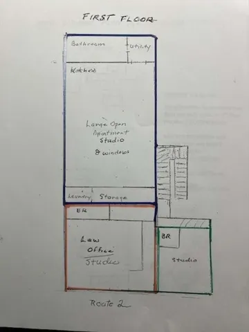 a view of a fire pit with large trees