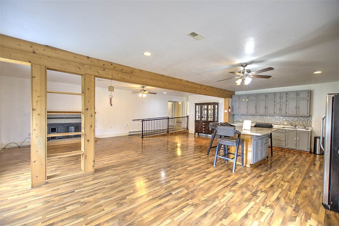 4402 East Rosewood Drive Decatur, IL 62521 - Photo 5 of 23 a view of a kitchen with kitchen island dining table and wooden floor