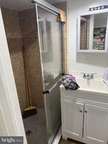 a bathroom with a sink and mirror