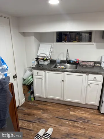 a kitchen with stainless steel appliances granite countertop a sink and cabinets