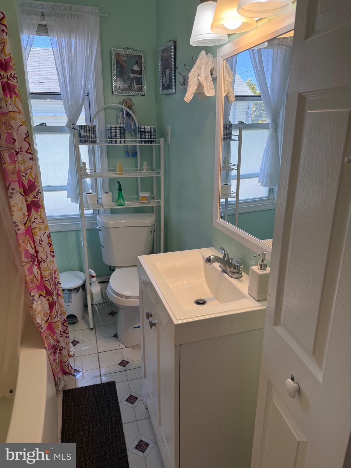 528 Magee Avenue Philadelphia, PA 19111 - Photo 17 of 29 a bathroom with a sink a toilet and mirror