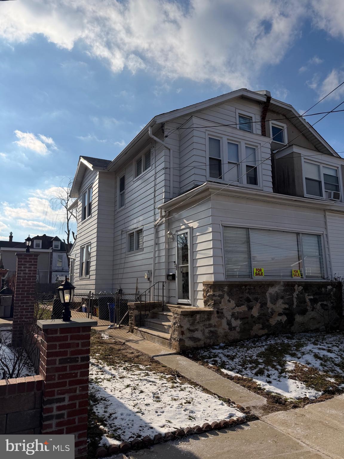 528 Magee Avenue Philadelphia, PA 19111 - Photo 29 of 29 a large building with a large window and potted plants