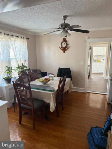 a view of a dining room with furniture and window