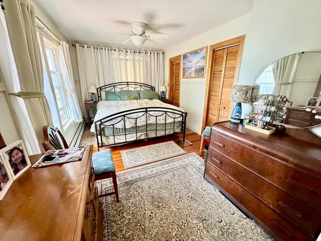 a bedroom with furniture and a window